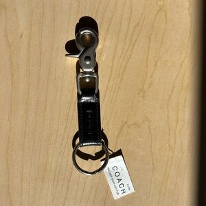 New black leather Coach trigger snap key fob